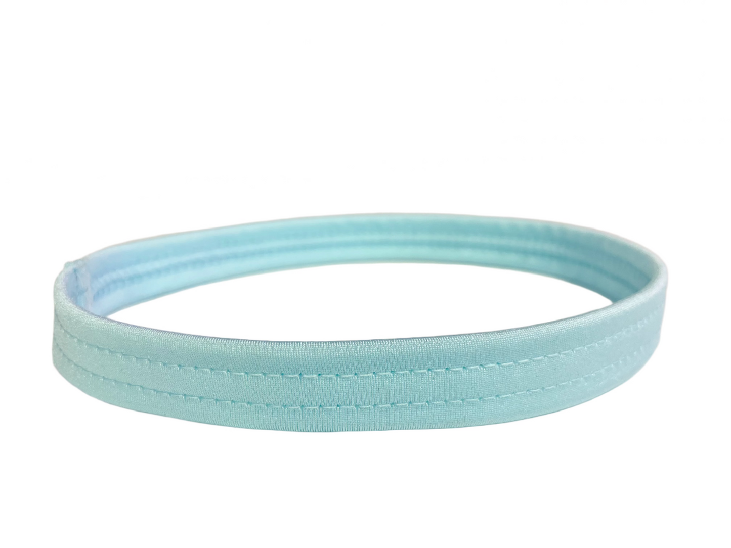 Baby blue thigh garter made of stretch elastic, worn by exotic dancers as a money band.
