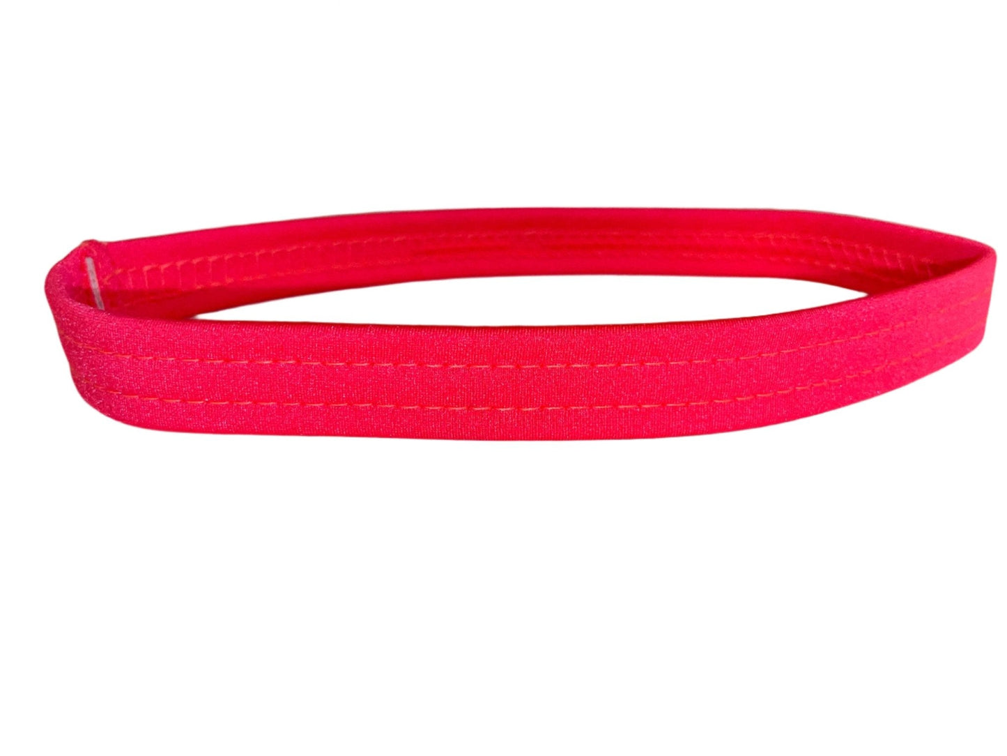 Coral thigh garter made of stretch elastic, worn by exotic dancers as a money band.