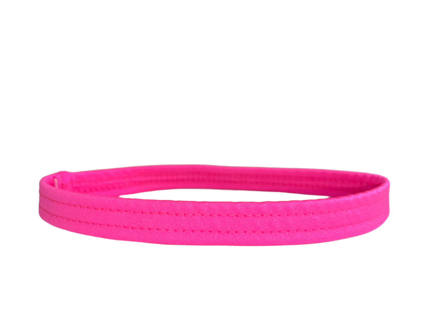 Neon pink thigh garter made of stretch elastic, worn by exotic dancers as a money band.